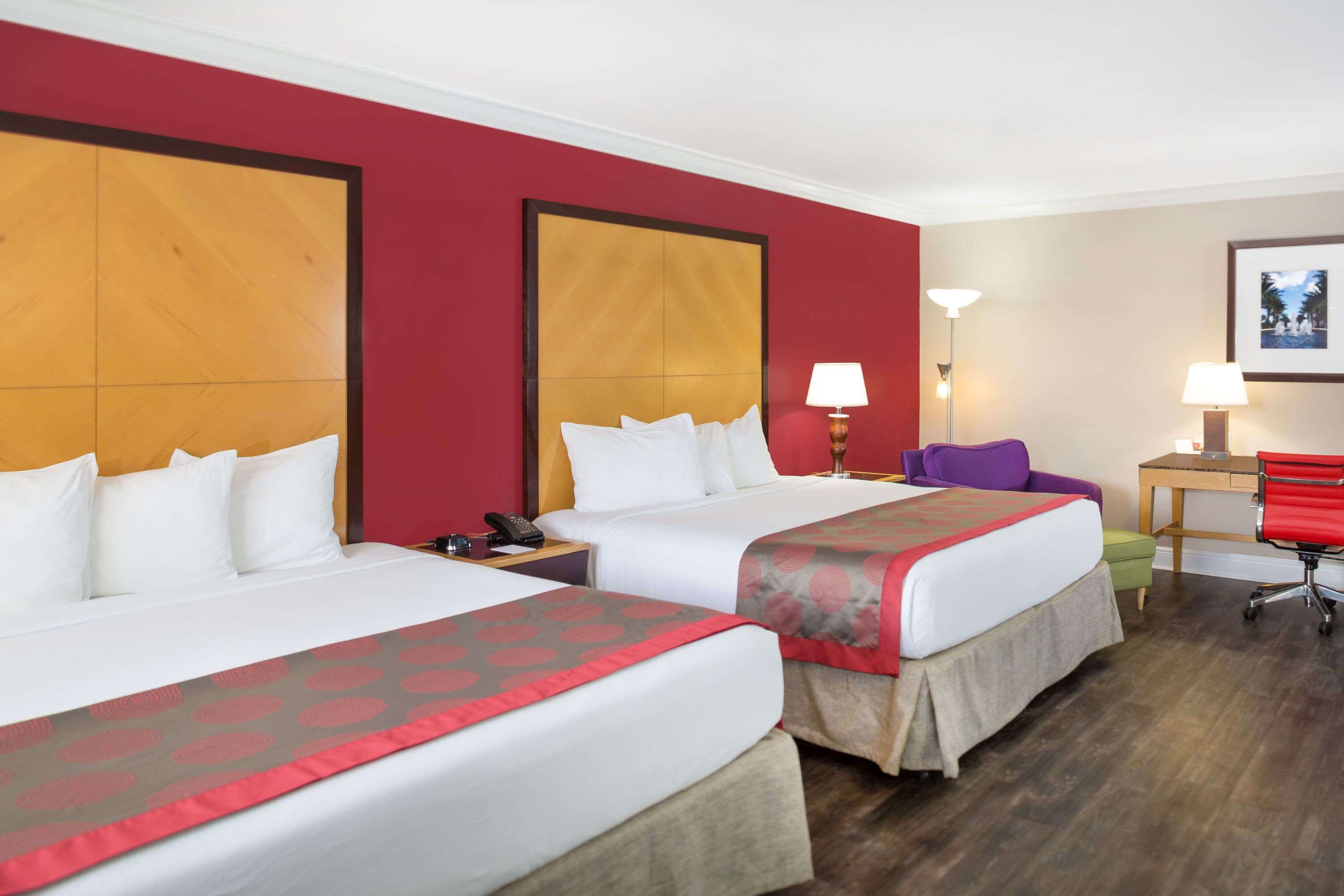deluxe room, multiple beds, non smoking | in-room safe, blackout curtains, soundproofing, iron/ironing board