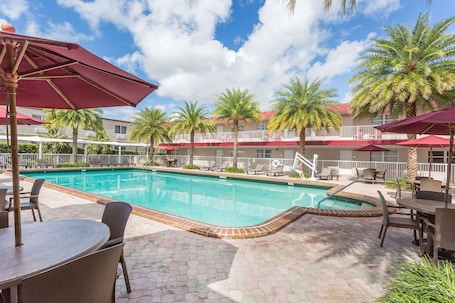 Outdoor pool. Ramada by Wyndham Miami Springs/Miami International Airport