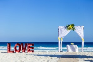 On the beach, white sand, beach towels