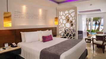 Jr Suite Swim up vista al mar | Artículos del minibar gratis y caja de seguridad en la habitación
