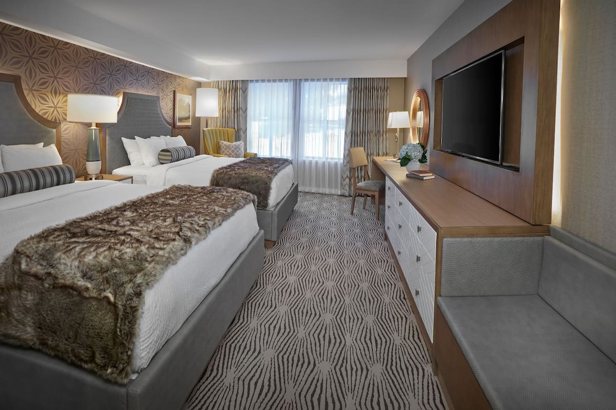 hypo-allergenic bedding, pillow-top beds, desk, laptop workspace