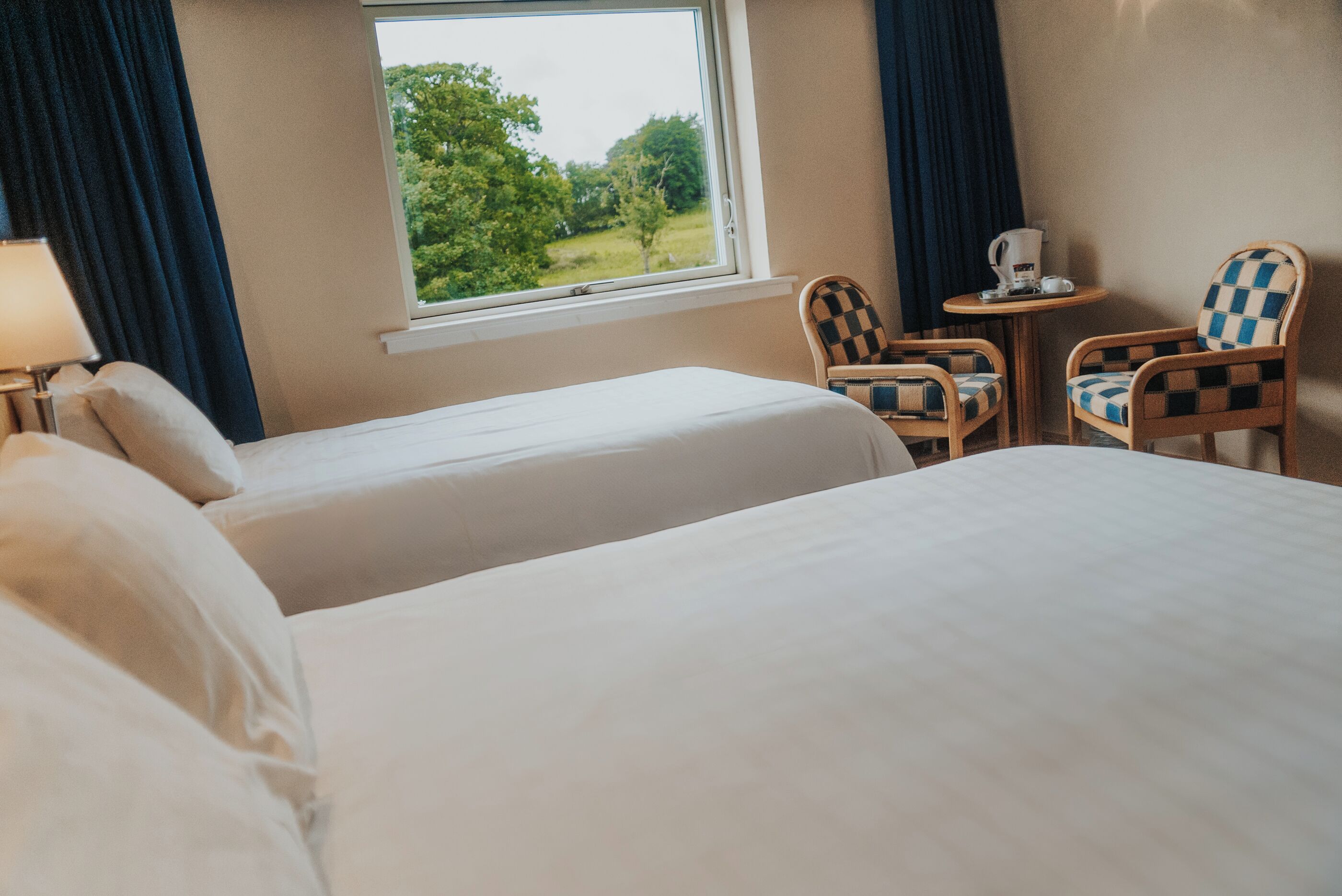 family room | 1 bedroom, in-room safe, desk, iron/ironing board