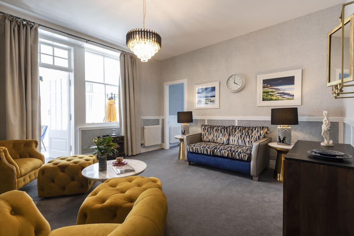 luxury suite | living area | 24-inch tv with satellite channels