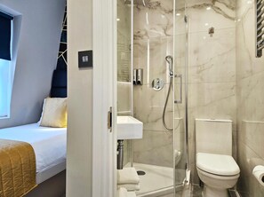 Shower, free toiletries, hair dryer, slippers