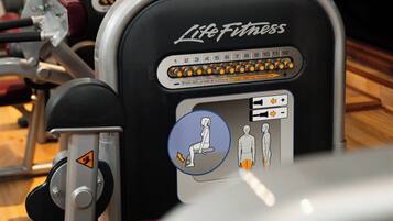 A row of Life Fitness exercise machines in a gym.