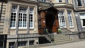 A multi-story building with a classic architectural style, featuring large windows and a central entrance with steps. - B+B Edinburgh (Edinburgh)