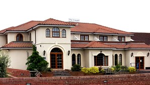 A large, two-story building with a tiled roof and a sign reading "The Vineyard". - Skylark Hotel (Southend-on-Sea)