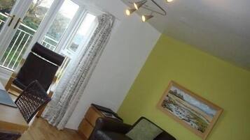Standard Suite, 2 Bedrooms, Balcony (Suite 5) | Living area | 50-inch flat-screen TV with digital channels, TV, DVD player