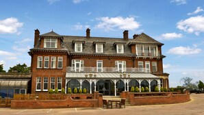 A large brick building with multiple windows and a balcony. - Wherry Hotel (Lowestoft)