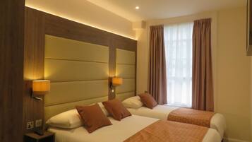 Standard Triple Room, 1 Bedroom, Private Bathroom, City View | Egyptian cotton sheets, pillow-top beds, individually decorated