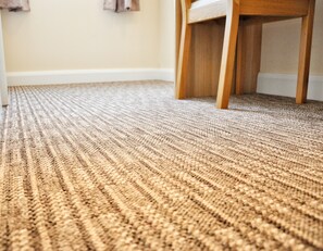 A close-up of a textured carpet with a diagonal weave pattern. - Carlton Hotel (Ipswich)