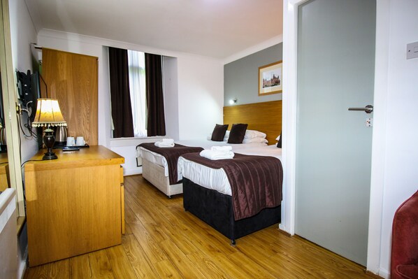 Individually decorated, desk, blackout drapes, iron/ironing board