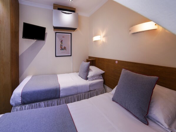 Standard Twin Room, 2 Twin Beds | In-room safe, bed sheets