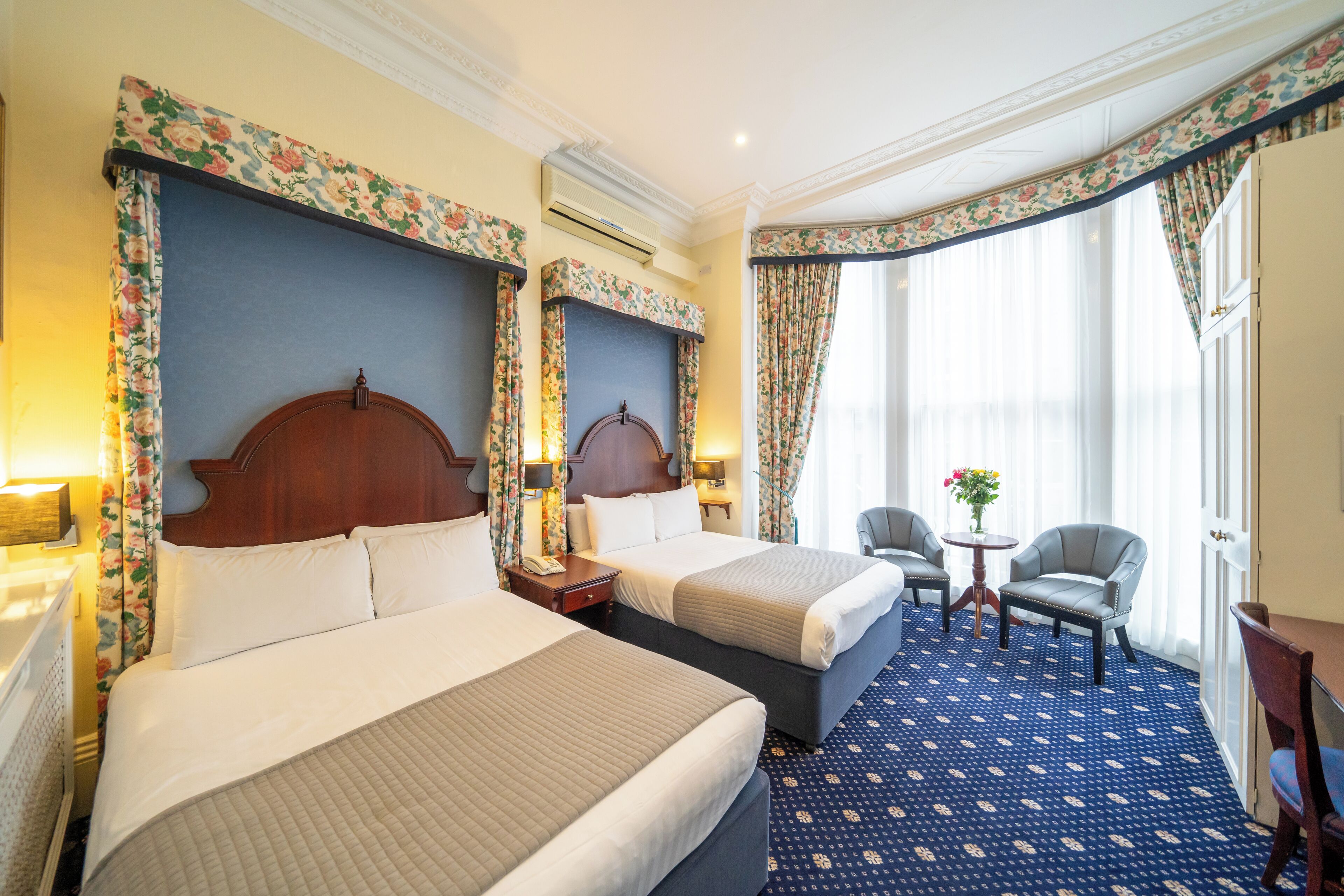 Family Room, Ensuite | Minibar, in-room safe, individually decorated, desk