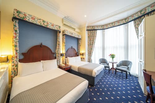 Family Room, Ensuite | Minibar, in-room safe, individually decorated, desk