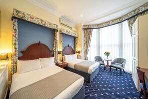 Family Room, Ensuite | Minibar, in-room safe, individually decorated, desk