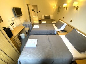 Quadruple Room | 1 bedroom, in-room safe, desk, iron/ironing board