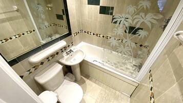 Quadruple Room | Bathroom | Shower, hair dryer, towels