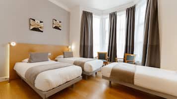 Triple Room | Desk, blackout drapes, free cribs/infant beds, free WiFi