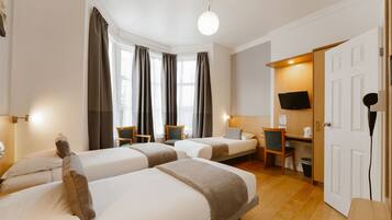 Triple Room | Desk, blackout drapes, free cribs/infant beds, free WiFi
