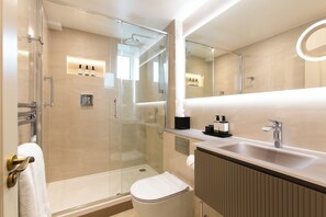 Designer toiletries, hair dryer, towels