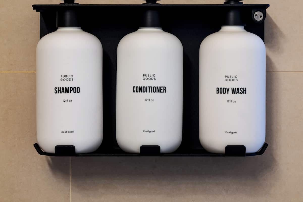 designer toiletries, hair dryer, towels, soap