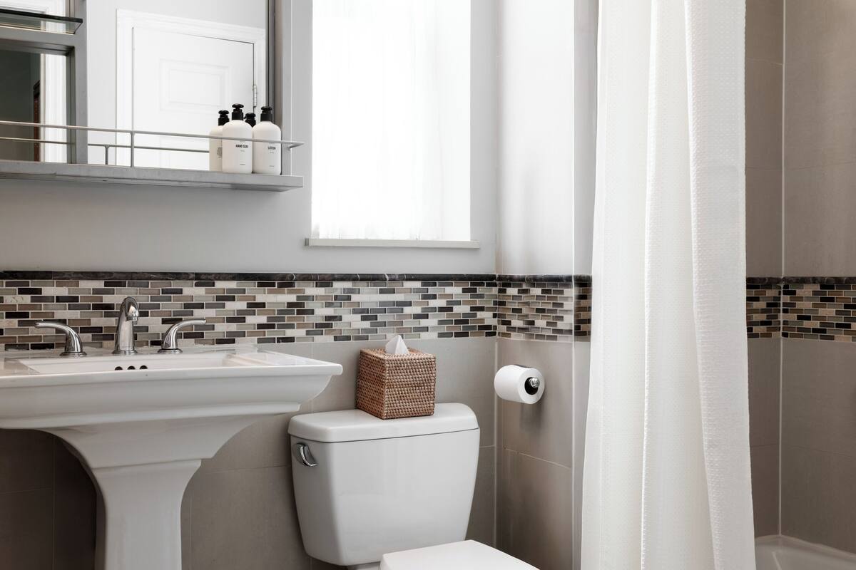 designer toiletries, hair dryer, towels, soap