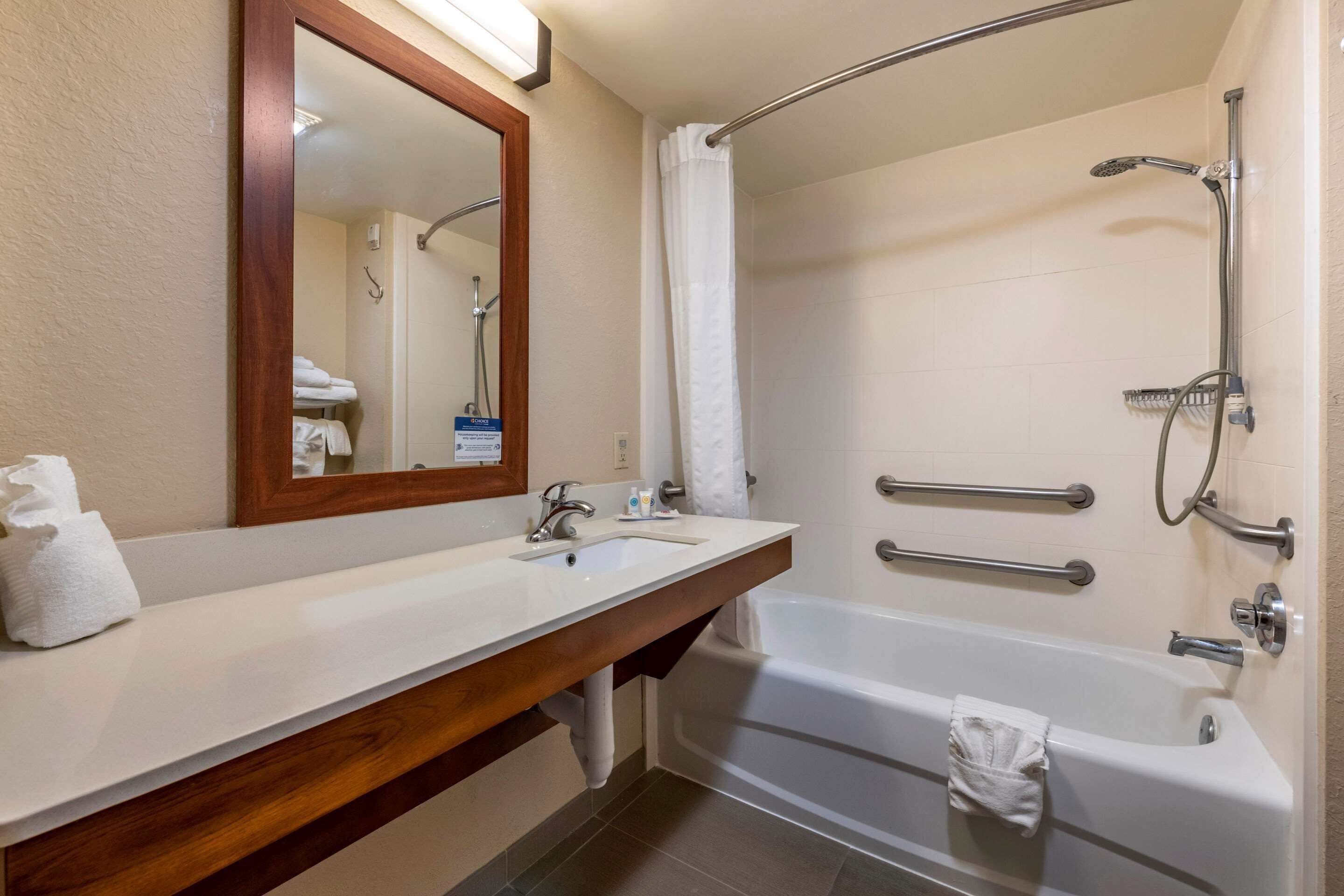 desk, laptop workspace, blackout curtains, iron/ironing board