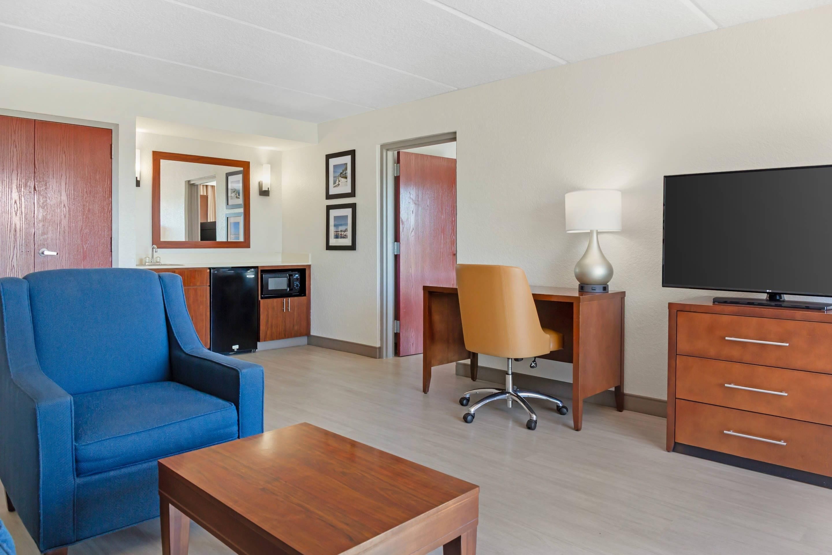 desk, laptop workspace, blackout curtains, iron/ironing board