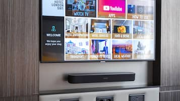 A digital display with various hotel information and services.