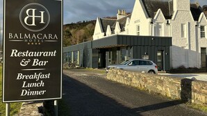 A sign for Balmacara Hotel Restaurant & Bar, indicating it offers breakfast, lunch, and dinner. - Balmacara Hotel (Kyle)