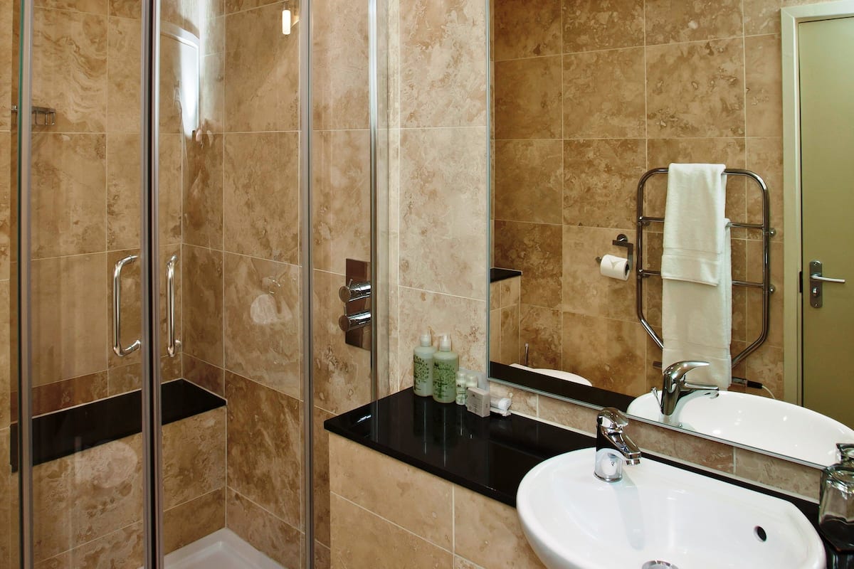 single room | bathroom | designer toiletries, hair dryer, bathrobes, slippers