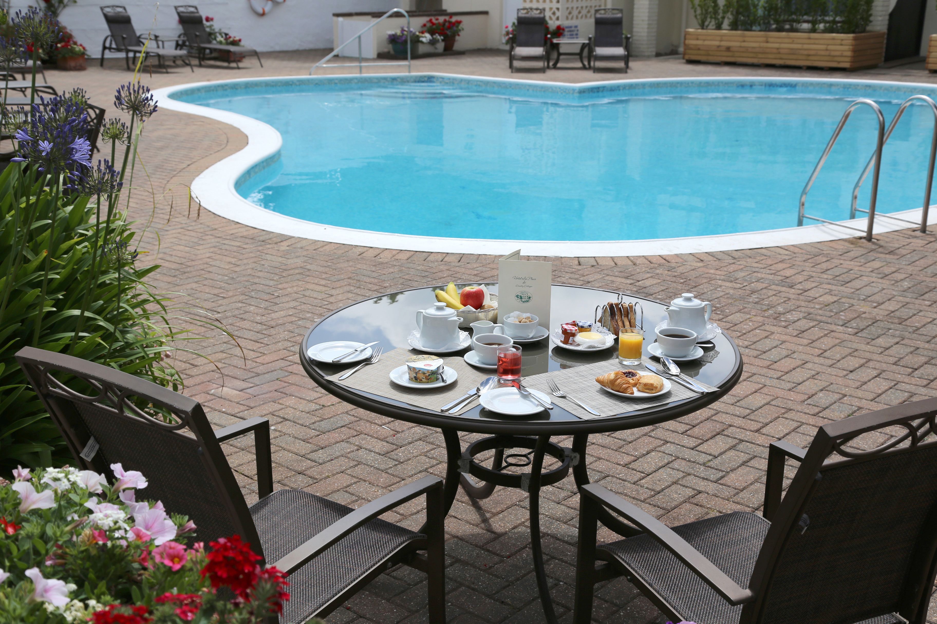 outdoor pool, open 9 am to 7 pm, pool loungers