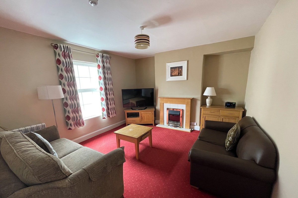 Family Suite, 2 Bedrooms, Kitchen | Living area | 65-inch Smart TV with digital channels, TV, iPod dock