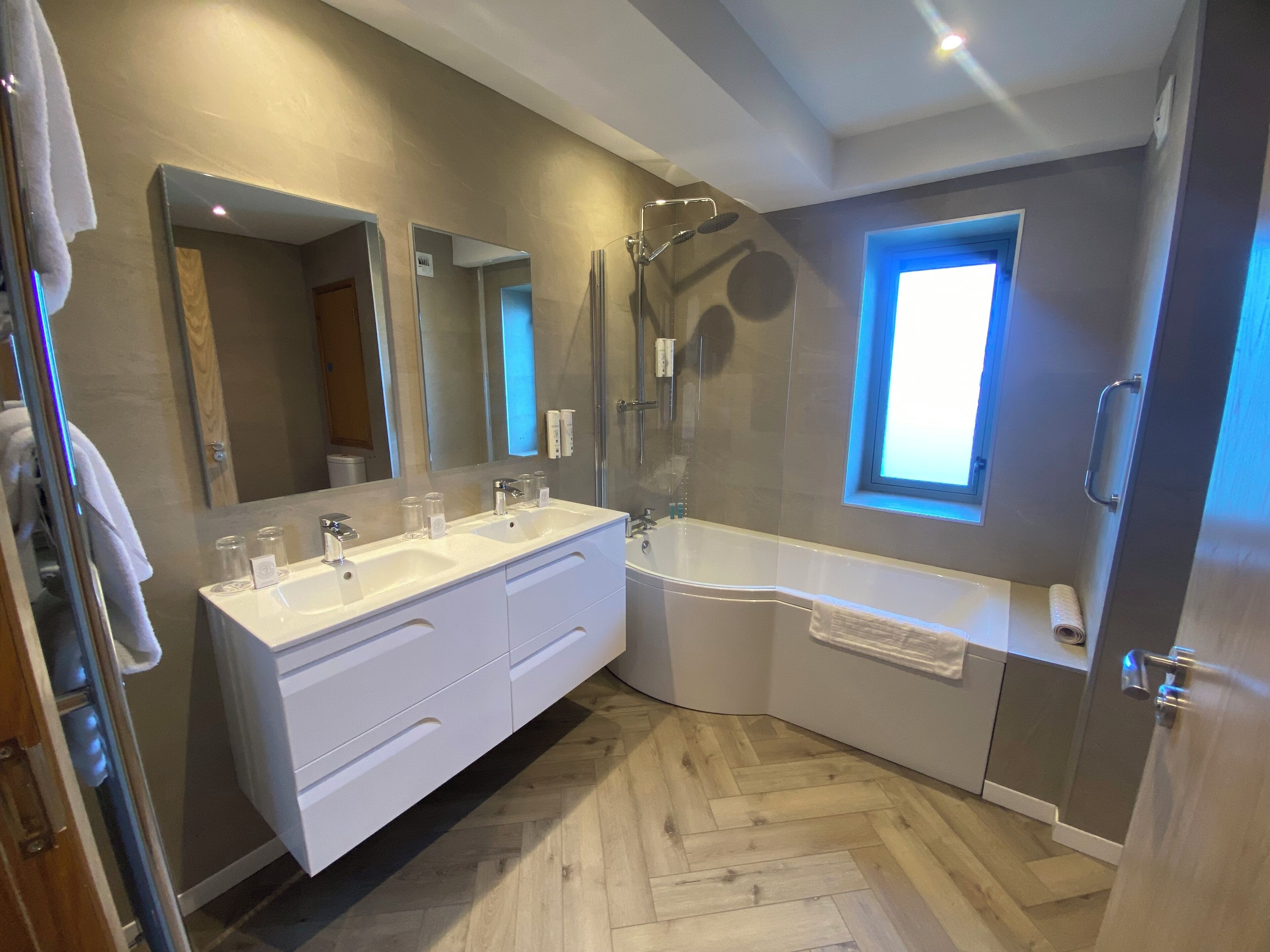superior family room | bathroom | shower, hair dryer, towels