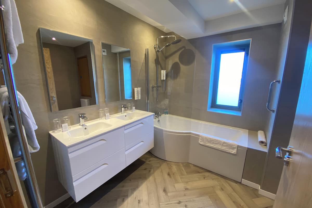 superior family room | bathroom | shower, hair dryer, towels