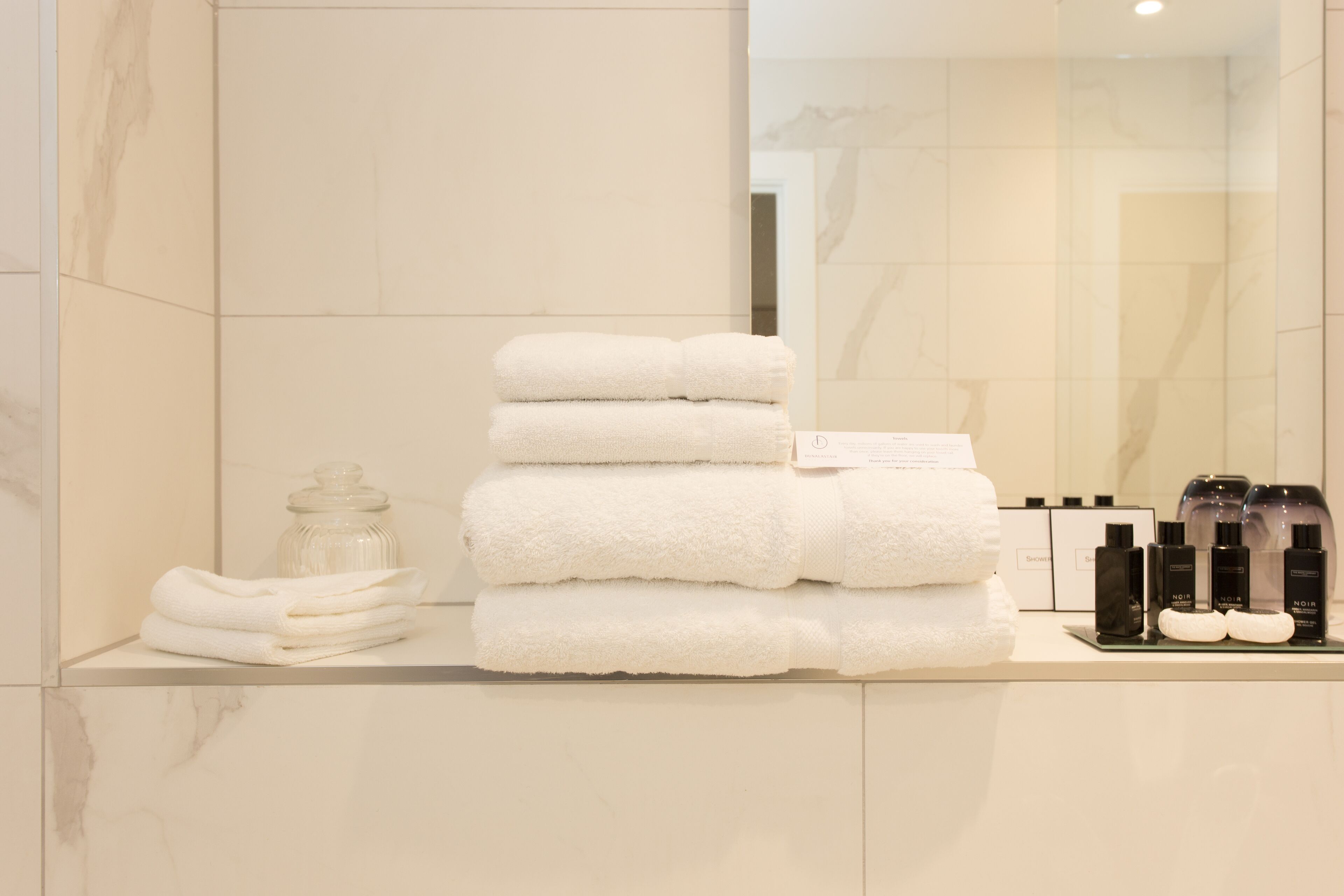 designer toiletries, hair dryer, bathrobes, slippers