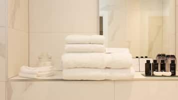 Designer toiletries, hair dryer, bathrobes, slippers