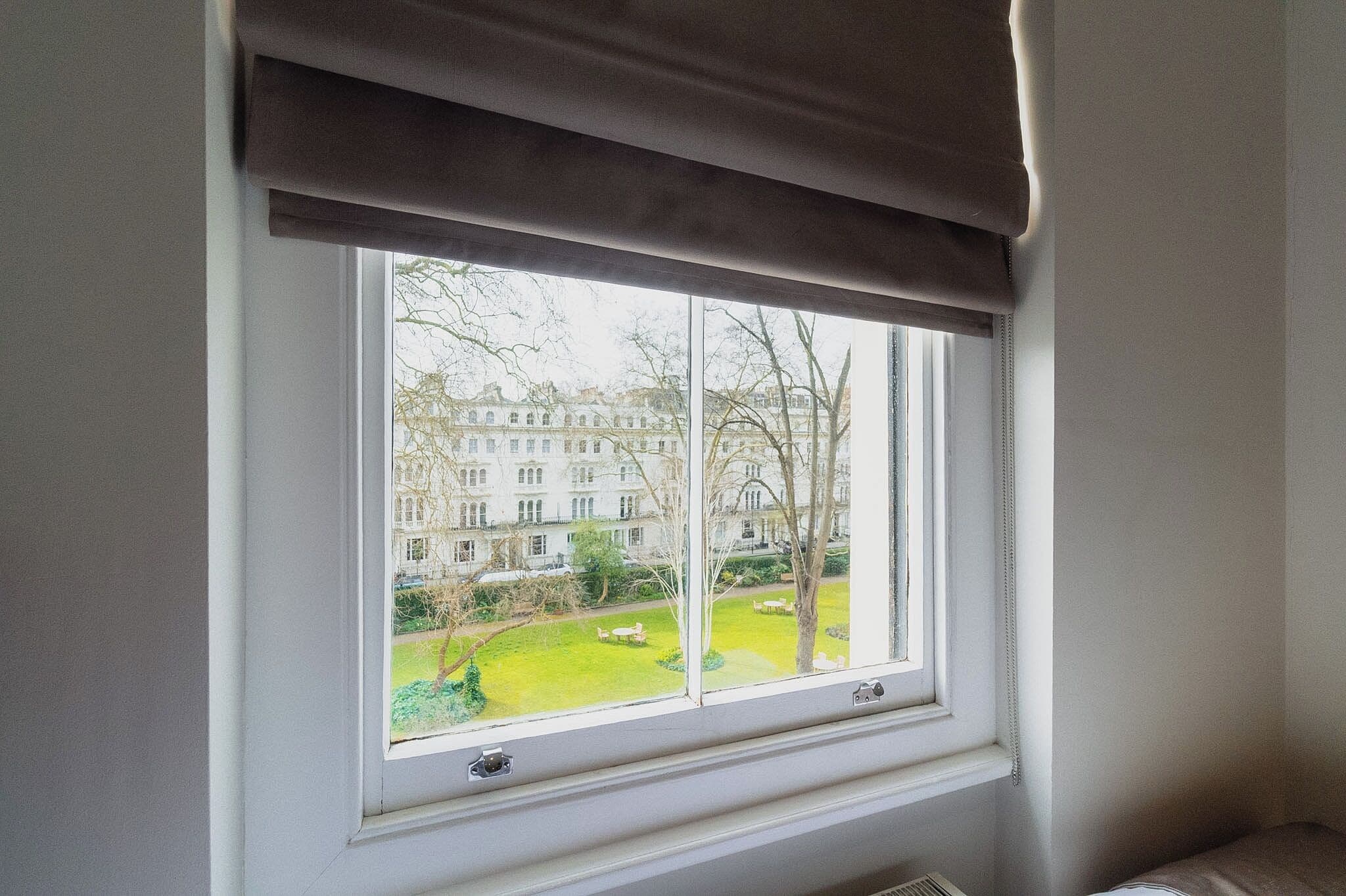 twin room, garden view | minibar, in-room safe, iron/ironing board, free wifi