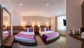 Family Room, 2 Double Beds | Minibar, in-room safe, iron/ironing board, free WiFi