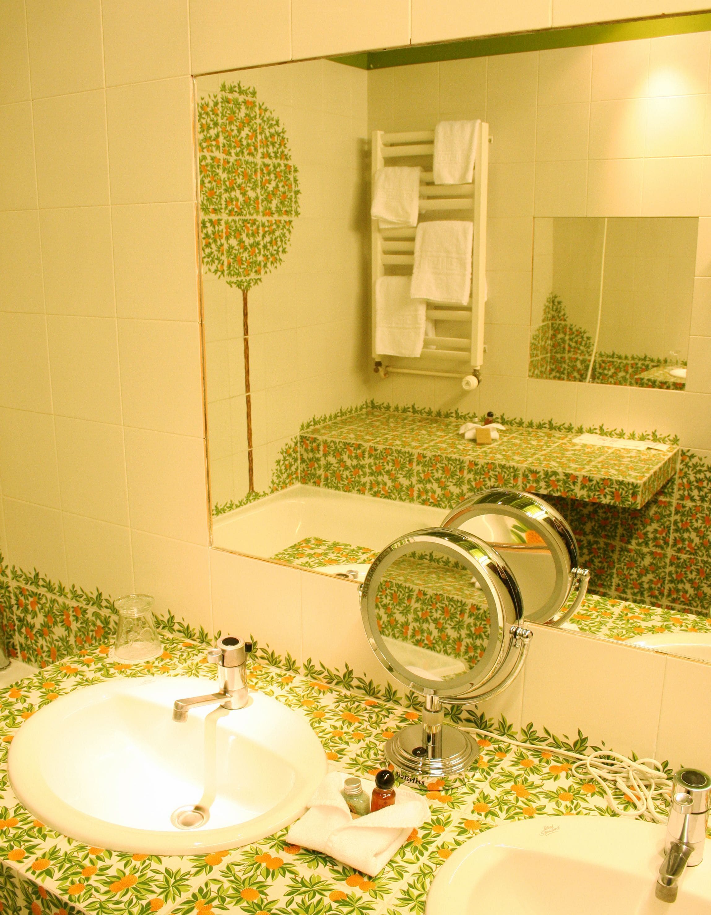 deluxe triple room | bathroom | bathtub, hair dryer, towels
