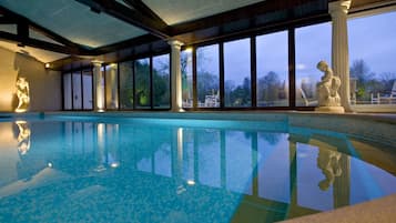 Indoor pool, open 8:00 AM to 8:00 PM, pool loungers