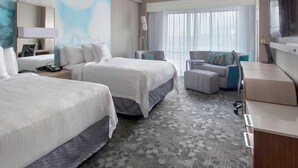 A hotel room with two beds, a desk, a chair, and a TV. - Courtyard by Marriott Newark Elizabeth (Elizabeth)