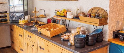 A breakfast buffet with various food items and condiments.