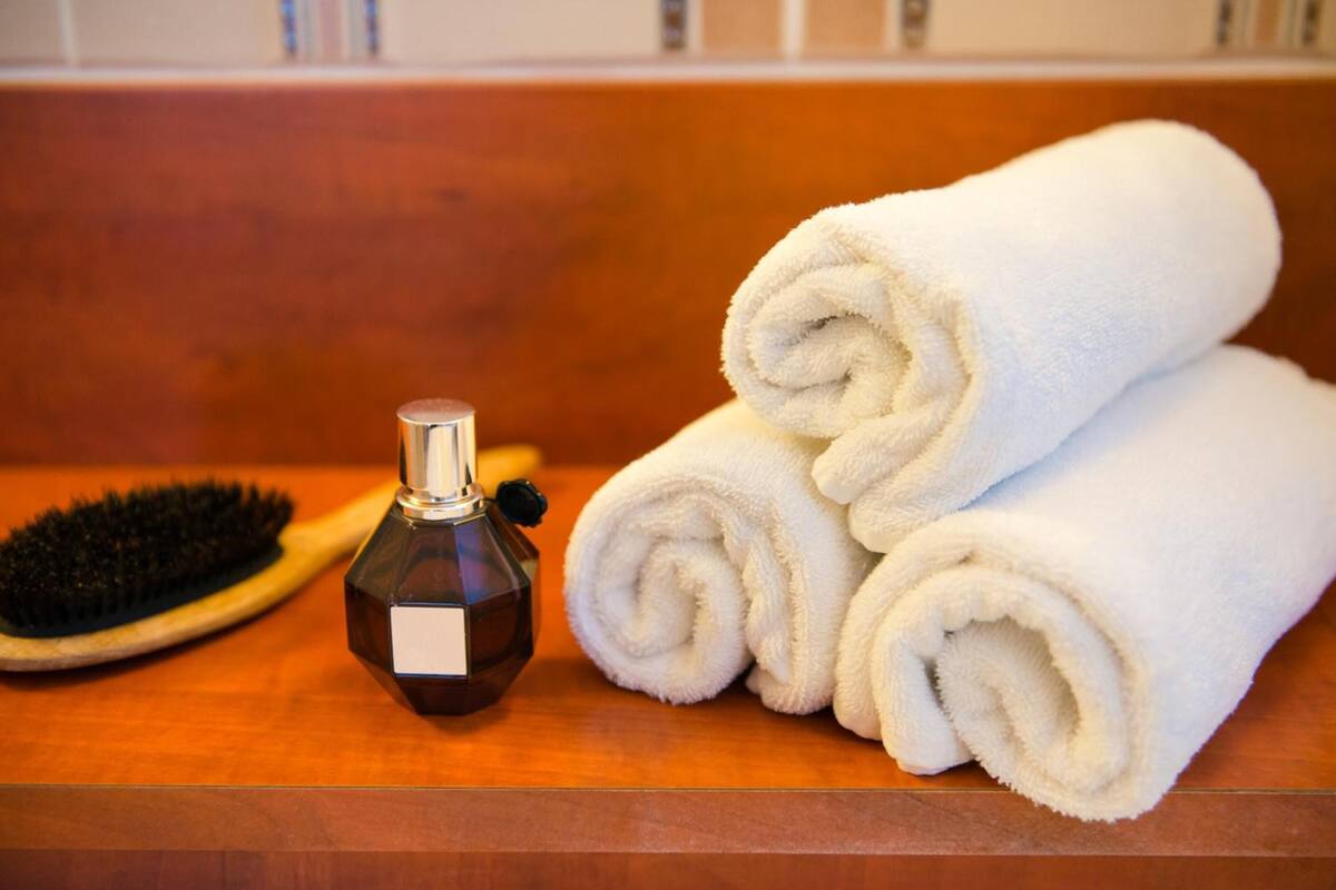 eco-friendly toiletries, hair dryer, towels