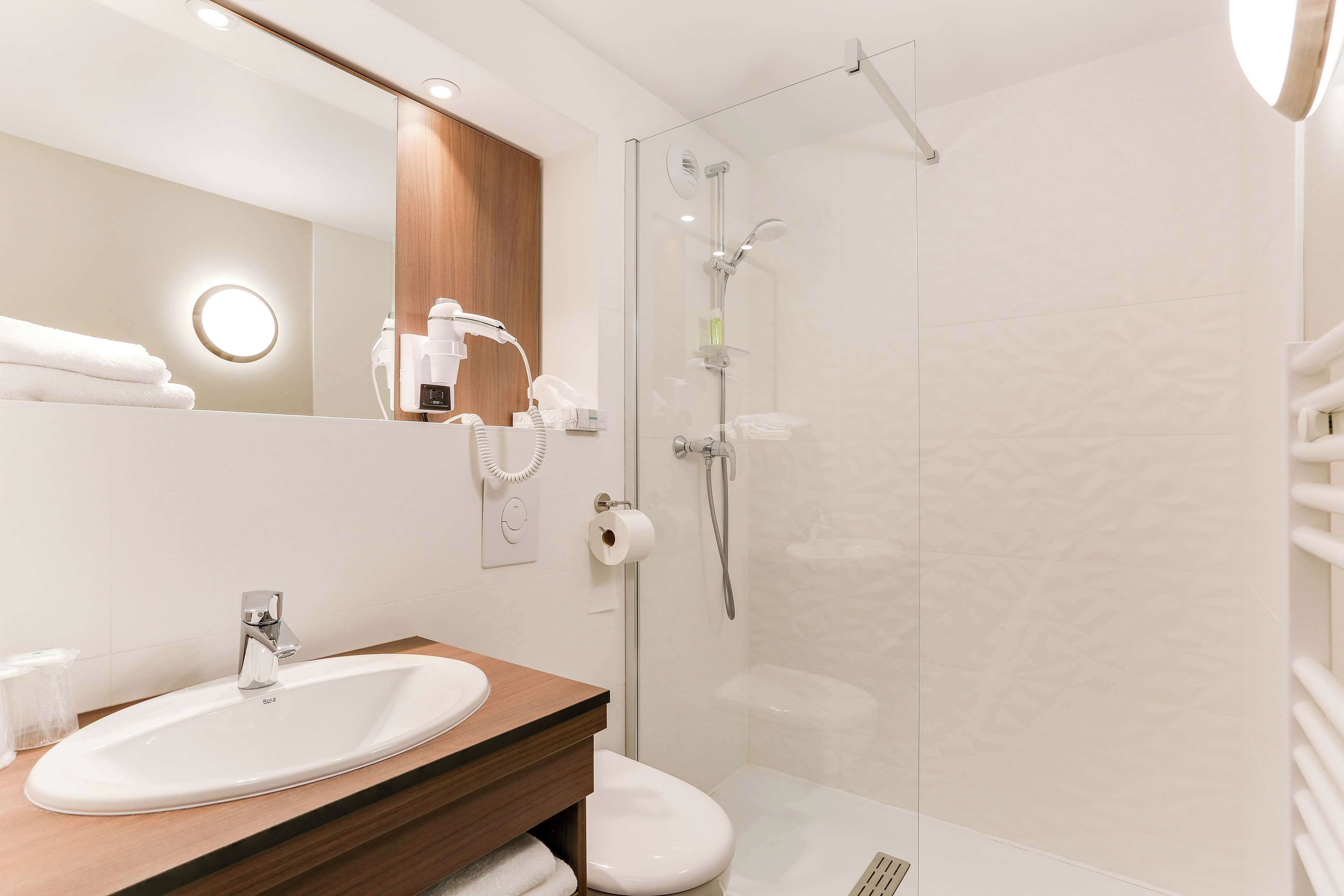 eco-friendly toiletries, hair dryer, towels