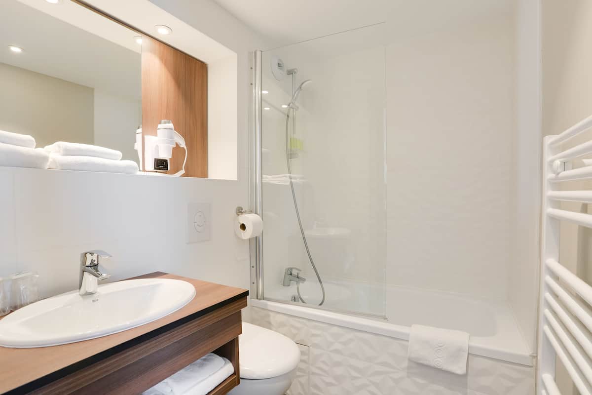 superior family room | bathroom | eco-friendly toiletries, hair dryer, towels