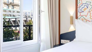 Habitación estándar, 1 cama individual | Ropa de cama de alta calidad, camas con pillow-top y cortinas blackout