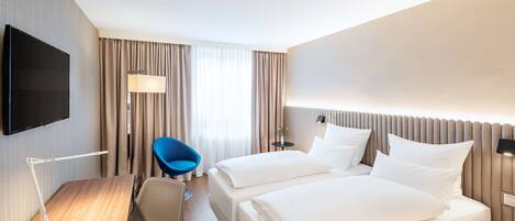 Hypo-allergenic bedding, pillow-top beds, in-room safe, desk