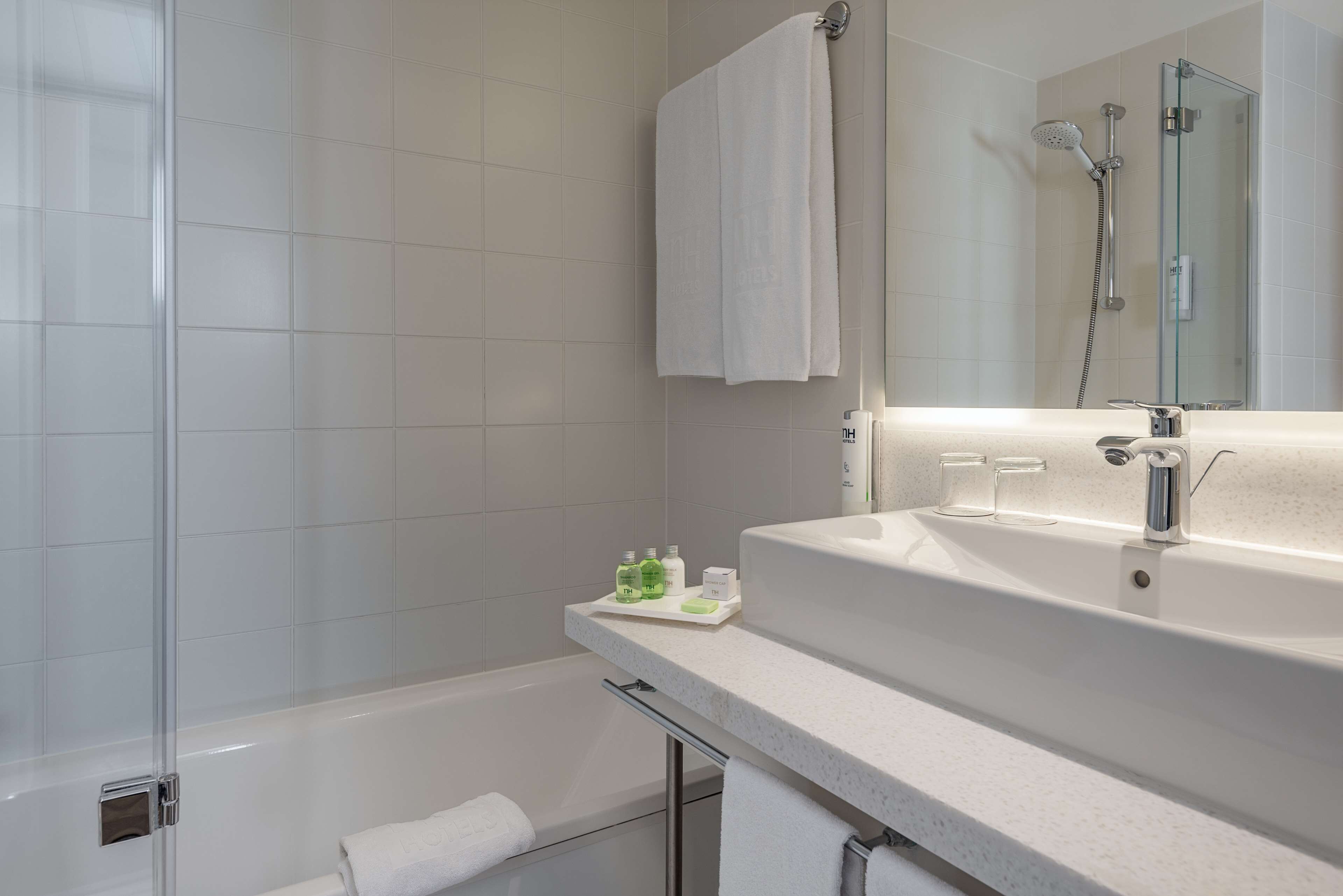 deep-soaking bathtub, rainfall showerhead, eco-friendly toiletries